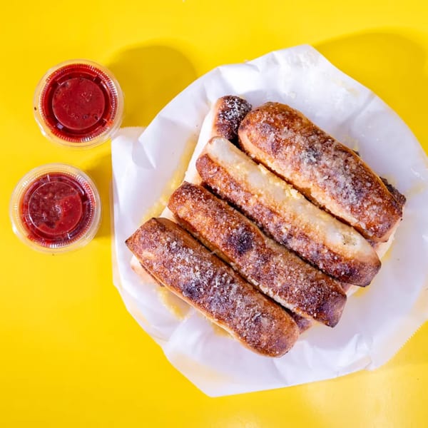 Golden brown breadsticks sprinkled with Parmesan cheese, served with two cups of marinara sauce.